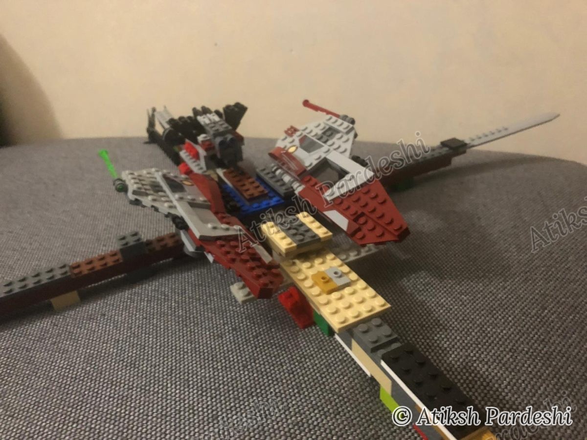 A self-designed Lego aircraft with cockpit canopy and forward-mounted armament